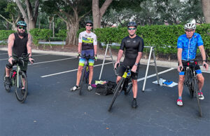 Triathletes getting on their bikes for a mini brick workout.